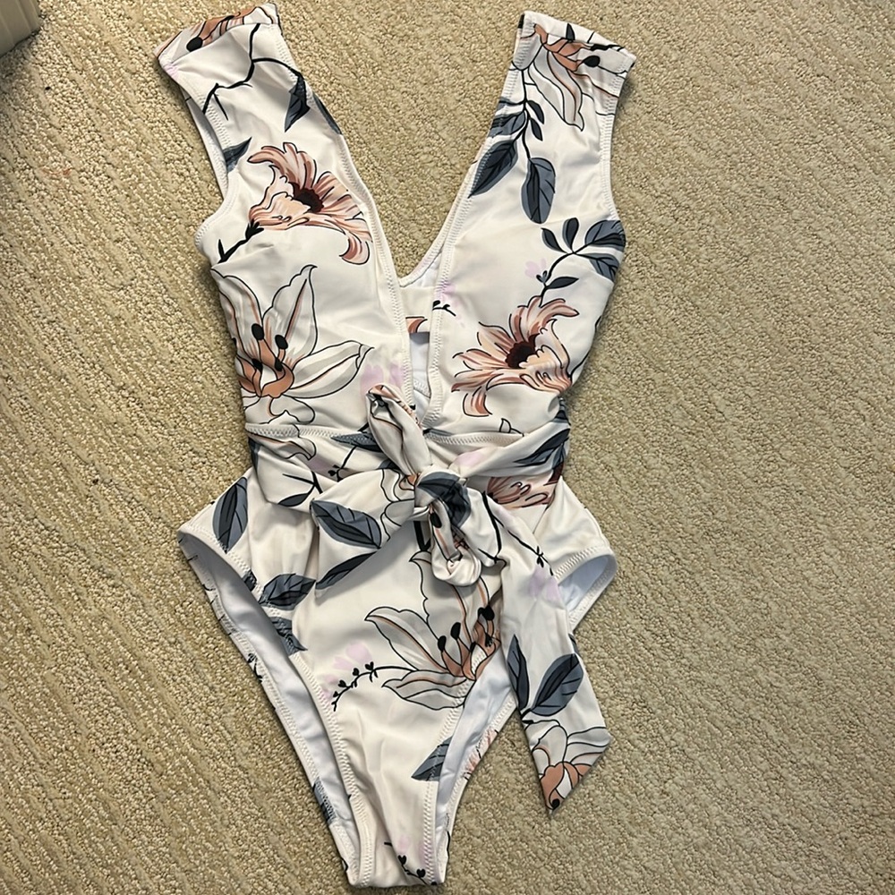 Size small one piece swim suit. Never worn. Tags removed.